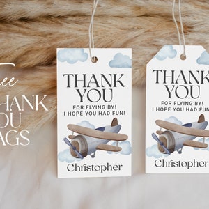 May include: Two blue and white thank you tags with a watercolor airplane design. The text on the tags reads "Thank You for flying by! I hope you had fun!" and includes the name "Christopher".