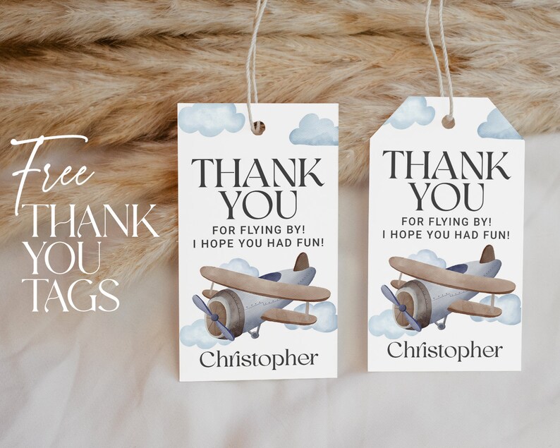 May include: Two blue and white thank you tags with a watercolor airplane design. The text on the tags reads "Thank You for flying by! I hope you had fun!" and includes the name "Christopher".