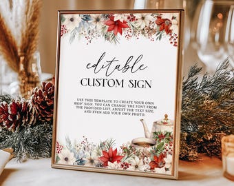 May include: Editable 8x10 inch custom sign template with a winter floral design featuring red poinsettias, white flowers, and greenery. The text reads "editable CUSTOM SIGN" and "USE THIS TEMPLATE TO CREATE YOUR OWN 8X10 SIGN. YOU CAN CHANGE THE FONT FROM THE PROVIDED LIST, ADJUST THE TEXT SIZE, AND EVEN ADD YOUR OWN PHOTO."
