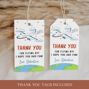 May include: Two white thank you tags featuring blue and red airplane illustrations. The text on the tags reads "Thank you for flying by! I hope you had fun! Love, Sebastian". The tags are decorated with blue and green globe illustrations.