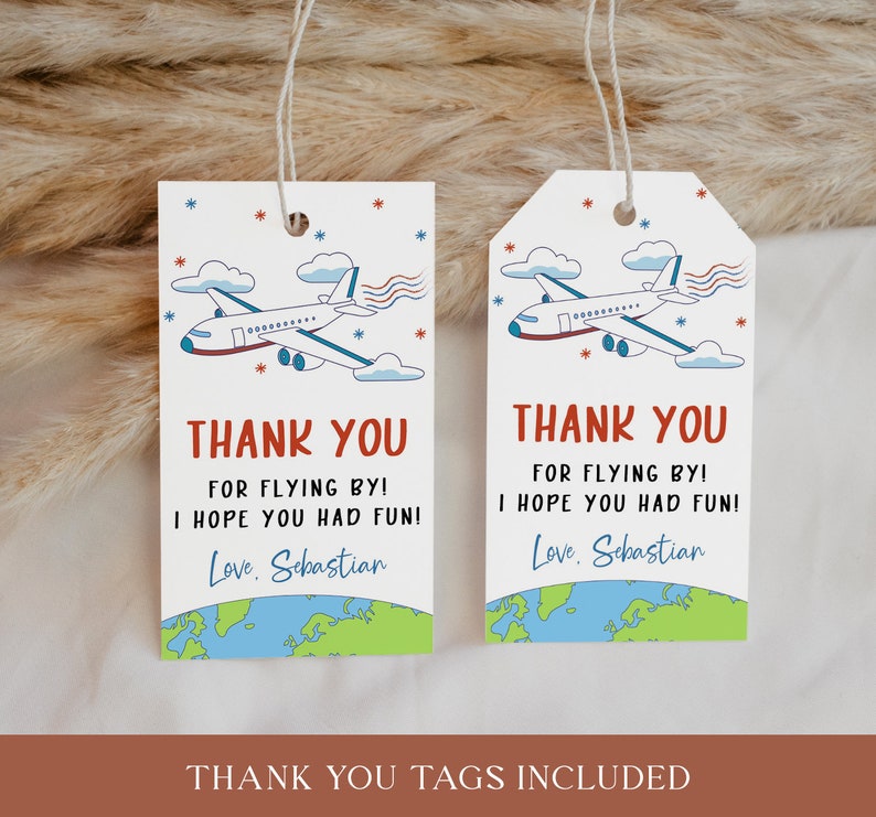 May include: Two white thank you tags featuring blue and red airplane illustrations. The text on the tags reads "Thank you for flying by! I hope you had fun! Love, Sebastian". The tags are decorated with blue and green globe illustrations.