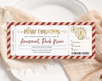 May include: A Christmas-themed gift voucher with a red and gold color scheme. The voucher features the text "Merry Christmas" and "Amusement Park Name". It includes fields for adding a location, recipient, sender, and date. The design incorporates a Ferris wheel illustration.