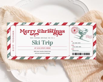 Puede incluir: Un vale de regalo a rayas rojas y verdes con el texto "Feliz Navidad" y "Ski Trip" en una fuente festiva. El vale es para un viaje de esquí e incluye espacio para el nombre del destinatario, la fecha y un mensaje personal.