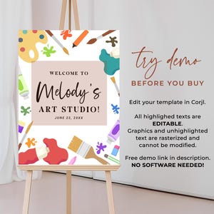 May include: An art studio welcome sign on an easel. The sign features the text "Welcome to Melody's Art Studio!" with colorful paint splatters, brushes, and a palette design. The sign also includes the text "Try demo before you buy."