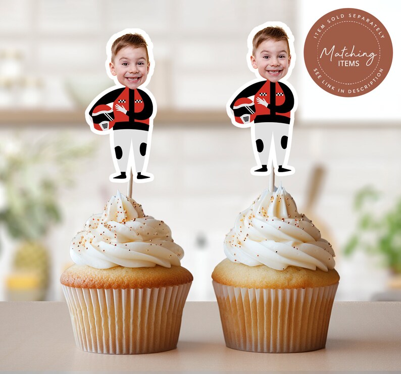 May include: Two cupcakes with white frosting and gold sprinkles topped with edible images of boys wearing racing helmets and suits. The images are on toothpicks and say "Matching Items" on the top.