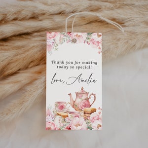May include: A white thank you tag with pink floral designs and a teapot with teacups and pastries. The text reads "Thank you for making today so special! Love, Amelia."