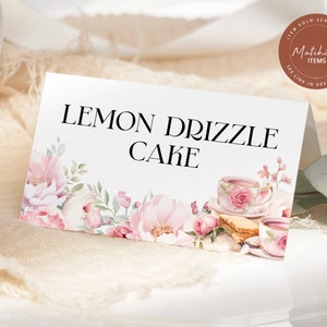 May include: White card with pink floral border and text "LEMON DRIZZLE CAKE". The card has a watercolor illustration of teacups and saucers with pink roses.