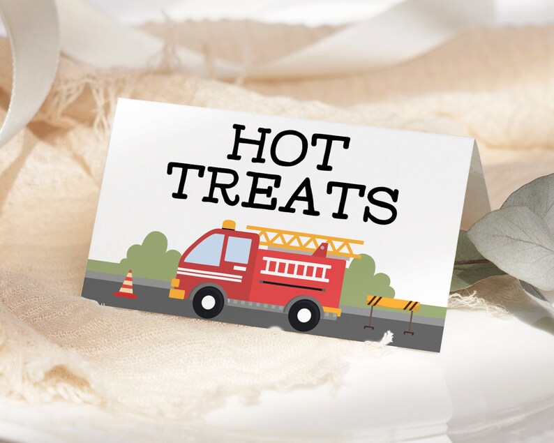 May include: A red fire engine with a yellow ladder and black wheels on a white background with the text "HOT TREATS" in black.