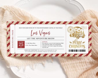 May include: A red and white striped boarding pass with gold snowflakes and a gold car with a Christmas tree on top. The text on the boarding pass reads "Las Vegas" and "Merry Christmas".