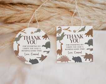 May include: Two round and square thank you tags with a dinosaur theme. The tags are white with brown and green dinosaur silhouettes. The text reads "Thank You for stomping by! I hope you had a roaring good time! Love, Conrad."