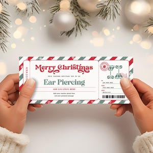 May include: A red and white striped Christmas gift voucher with the text "Merry Christmas" and "Ear Piercing". The voucher has a snowflake design and a green and white border.