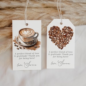 May include: Two white gift tags with watercolor coffee-themed designs. One features a latte with heart art, the other a heart made of coffee beans. Text reads "A perfect blend of love & gratitude! Thank you for being here!" and "love, Serena."