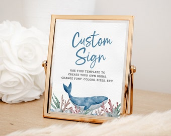 May include: A gold-framed sign with a white background and blue text that reads "Custom Sign". The text below the title says "Use this template to create your own signs. Change font, colors, sizes, etc." The sign features a watercolor illustration of a blue whale with coral and seaweed.