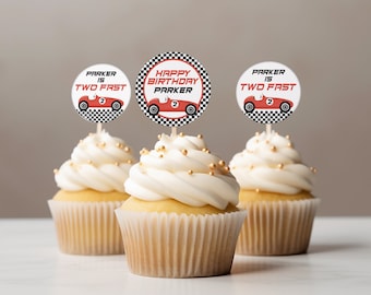 May include: Three cupcakes with white frosting and gold sprinkles. Each cupcake has a circular topper with a red race car design and the text "Parker is Two Fast" or "Happy Birthday Parker". The toppers have a black and white checkered border.