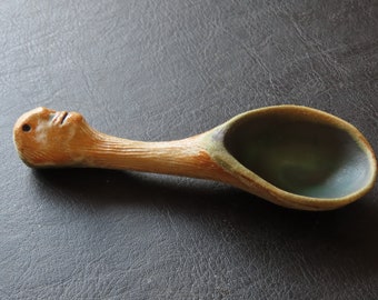 Coffee scoop sculpted in stoneware clay for ground coffee. textured and glazed 14cm x 4cm dishwasher safe, can be kept in your coffee jar.
