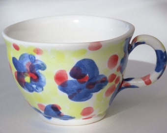 Floral hand painted porcelain espresso cup. Hand thrown in Scotland by Jenny Finch 110ml 6cm tall x 8cm wide. Dishwasher safe.