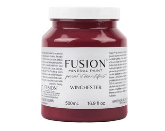 May include: A jar of Fusion Mineral Paint in the color "Winchester." The jar is a deep burgundy color with a white lid. The label includes the brand name, paint type, color name, and volume of 500mL or 16.9 fl oz.