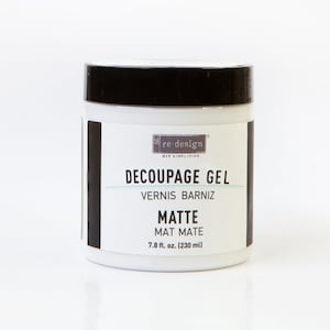 May include: A white jar of Re-Design Decoupage Gel with a black lid. The label reads "Decoupage Gel, Vernis Barniz, Matte, Mat Mate, 7.8 fl. oz. (230 ml)"