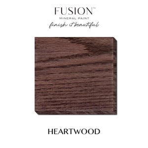 May include: A close-up of a rectangular wooden block with a dark brown, textured surface. The block is labeled "HEARTWOOD" in a bold, sans-serif font. Above the block, the text "FUSION MINERAL PAINT" and "finish it beautiful" are displayed.