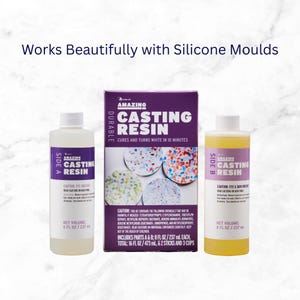 May include: A casting resin kit with two bottles labeled "Side A" and "Side B", and a purple box. The box reads "Amazing Casting Resin" and "Cures and turns white in 10 minutes." Each bottle contains 8 fl oz / 237 mL.