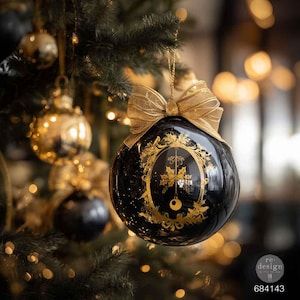 May include: A glossy black spherical Christmas ornament featuring a gold-toned ornate oval frame design with botanical details and a central hanging element. The ornament is topped with a sheer gold ribbon bow and hangs from a pine tree branch.