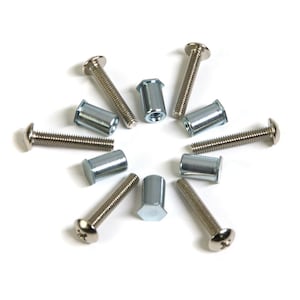 May include: An assortment of silver-colored screws and threaded inserts arranged on a white background. The screws have rounded heads and threaded shafts. The inserts are cylindrical with internal threads.