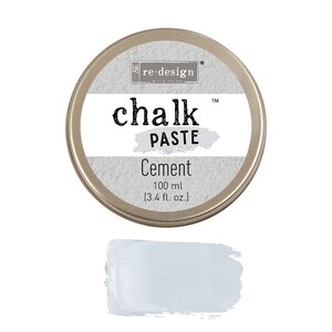 May include: A round tin container of re-design with prima chalk paste in the color cement. The tin is silver with a white label that says "re-design with prima chalk paste" and "Cement 100 ml (3.4 fl. oz.)".