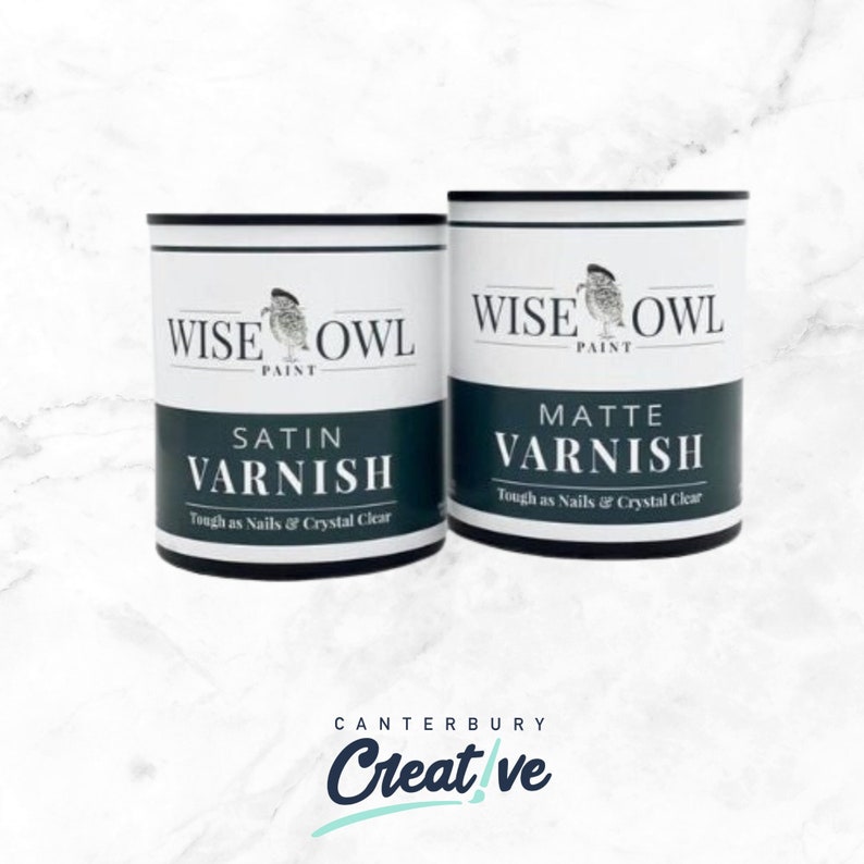 May include: Two cans of Wise Owl paint, one labeled "Satin Varnish" and the other labeled "Matte Varnish". Both cans are white with black lettering and a black owl logo.