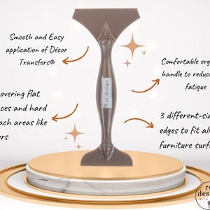 May include: A brown plastic tool for applying decor transfers with a central handle and three distinct edges. The tool features the text re-design with prima. Text on the image includes Smooth and Easy application of Décor Transfers, Comfortable ergonomic handle to reduce hand fatigue, For covering flat surfaces and hard to reach areas like corners, and 3 different-sized edges to fit all furniture surfaces.