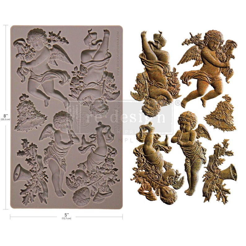 May include: A silicone mold featuring cherubic angel designs, measuring 8 inches (20.3 cm) by 5 inches (12.7 cm). The mold includes detailed relief images of angels with wings, flowers, and musical instruments. The angels are in various poses.