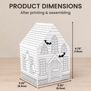 Finished printable house dimensions after assembly showing the size of the completed Halloween 3D paper house craft.