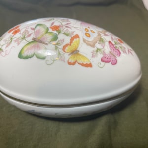 1979 Avon fine porcelain egg decorated with 22K gold trim.