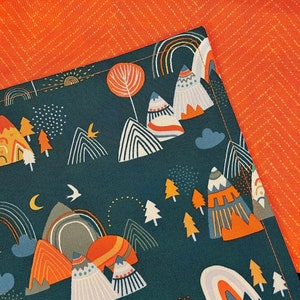 May include: A dark teal fabric with a mountain and rainbow pattern. The design includes orange, white, and gray mountains, rainbows, trees, and a crescent moon. The background is a solid orange fabric with a subtle chevron pattern.