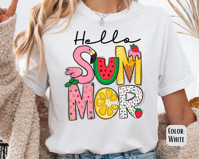 May include: White t-shirt with a colorful graphic that says "Hello Summer" with a flamingo, watermelon, lemon, ice cream cone, and sprinkles.