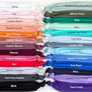 a large group of different colored shirts