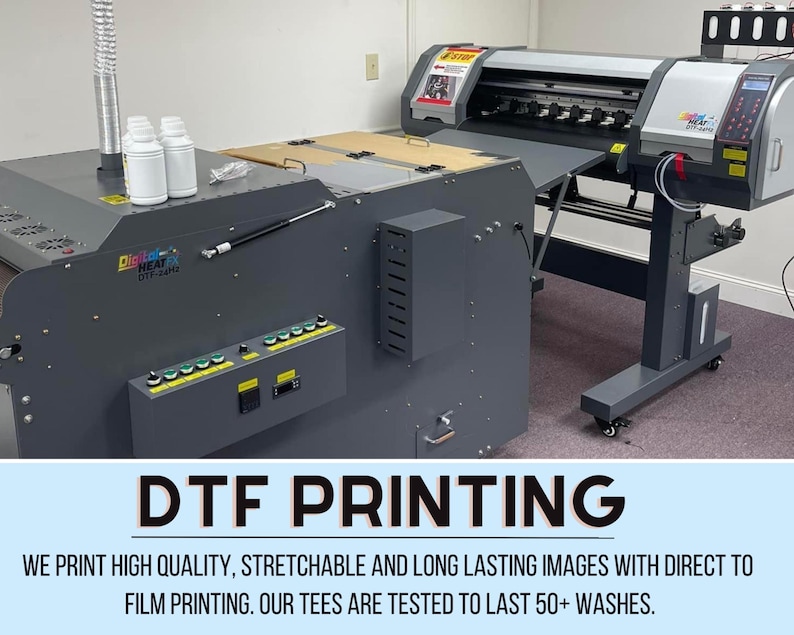 May include: A DTF printing machine with a large format printer. The image shows the machine's components, including ink bottles, control panels, and a printing bed. The text "DTF PRINTING" is displayed at the bottom.