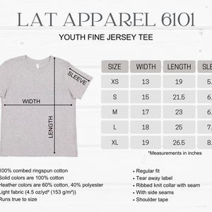 May include: A light gray Youth Fine Jersey Tee with a size chart showing measurements in inches. The shirt is made of 100% combed ringspun cotton and has a regular fit. The chart shows sizes XS to XL with width, length, and sleeve measurements.