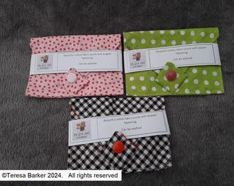 Poppered fabric purses.  Beautiful detail on front, two pockets inside.  Easily fits credit cards, business cards, and folded notes