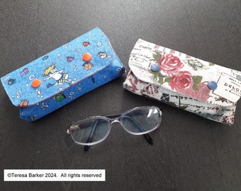 Fabric glasses case secured with poppers.  Can also be used as a bag tidy, pencil case and many other uses.  Made from fun cotton  fabric