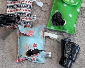 Fabric 'poo' bag holder.  Made from fun beautiful fabric.  Room for 2 poo bag rolls. Comes with hanging tag