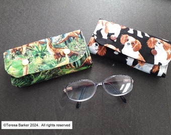 Fabric glasses case secured with poppers.  Can also be used as a bag tidy, pencil case and many other uses.  Made from fun cotton  fabric