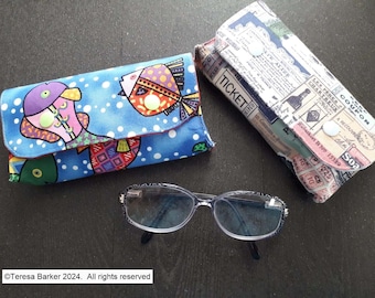 Fabric glasses case secured with poppers.  Can also be used as a bag tidy, pencil case and many other uses.  Made from fun cotton  fabric