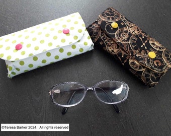 Fabric glasses case secured with poppers.  Can also be used as a bag tidy, pencil case and many other uses.  Made from fun cotton  fabric