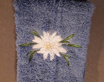 Embroidered hand and bath towels with the beautiful Edelweiss flower on it.