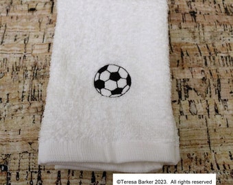 Machine embroidered face flannel with a football on it.