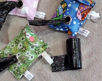Fabric 'poo' bag holder.  Made from fun beautiful fabric.  Room for 2 poo bag rolls. Comes with hanging tag