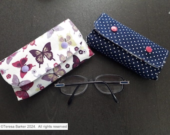 Fabric glasses case secured with poppers.  Can also be used as a bag tidy, pencil case and many other uses.  Made from fun cotton  fabric