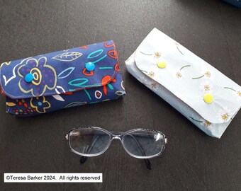 Fabric glasses case secured with poppers.  Can also be used as a bag tidy, pencil case and many other uses.  Made from fun cotton  fabric