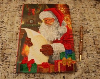 Hand decorated notebook with Santa on the front