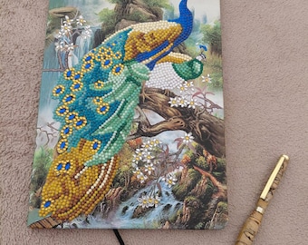 Hand decorated crystal art notebook featuring a beautiful peacock